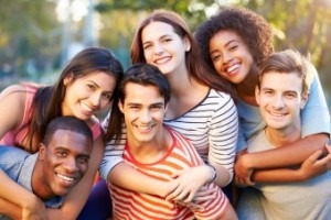 Outdoor Portrait Of Young Friends Having Fun In Park